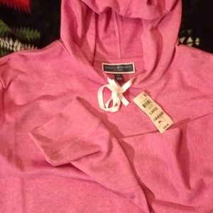 Karen Scott sports large hoodie